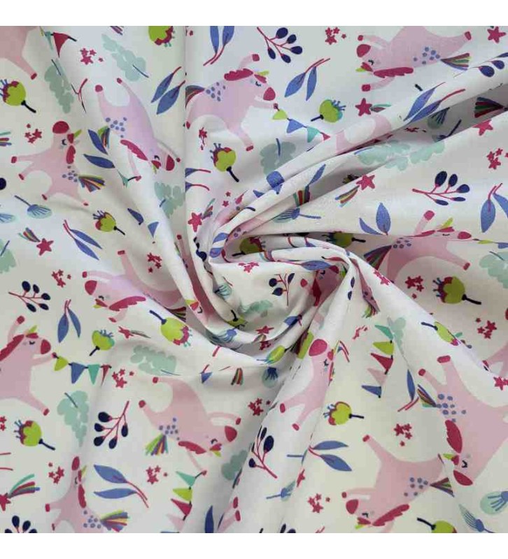 Tissu pastel avec de jolies licorne qui courent